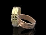 Klastys Ring in 18k yellow and rose gold — crackle-patterned band inspired by Ginnungagap, the Norse primordial void where the world was born.