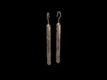 Manaih Earrings in 18k rose gold — carved cylinder drop earrings inspired by mana, the Māori concept of spiritual power and the tradition of whakairo carving