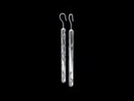 Manaih Earrings in 18k white gold — carved cylinder drop earrings inspired by mana, the Māori concept of spiritual power and the tradition of whakairo carving
