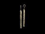 Manaih Earrings in 18k yellow gold — carved cylinder drop earrings inspired by mana, the Māori concept of spiritual power and the tradition of whakairo carving